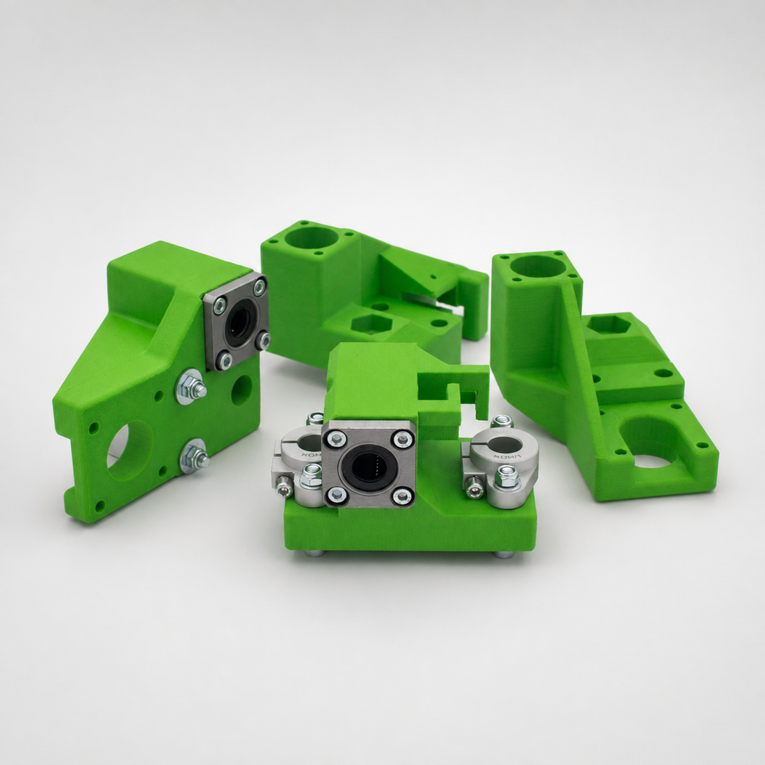 Industrial 3D printer components on a light studio background