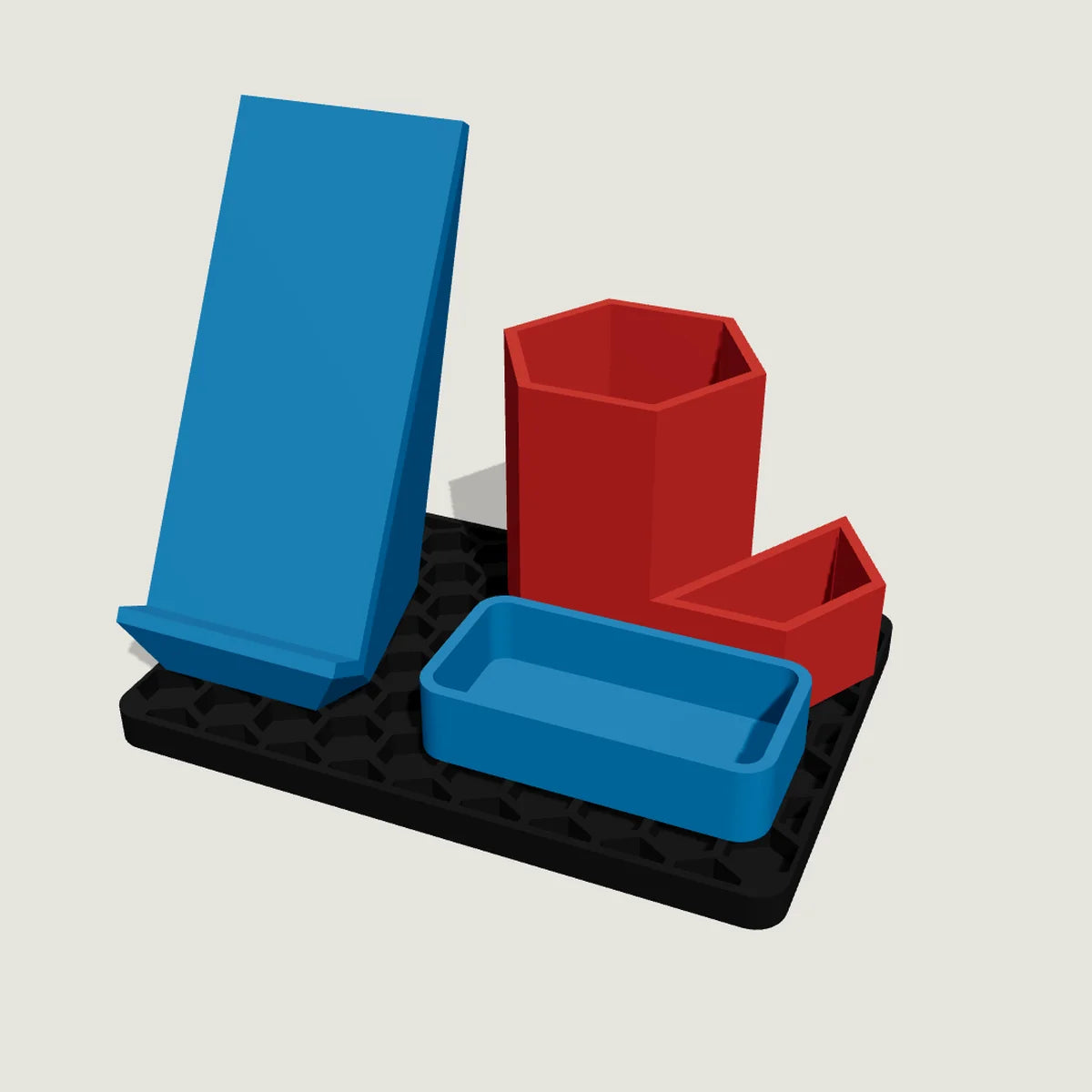 Aloha Stackables starter kit: blue phone holder, red hex holders and blue tray on a black base plate