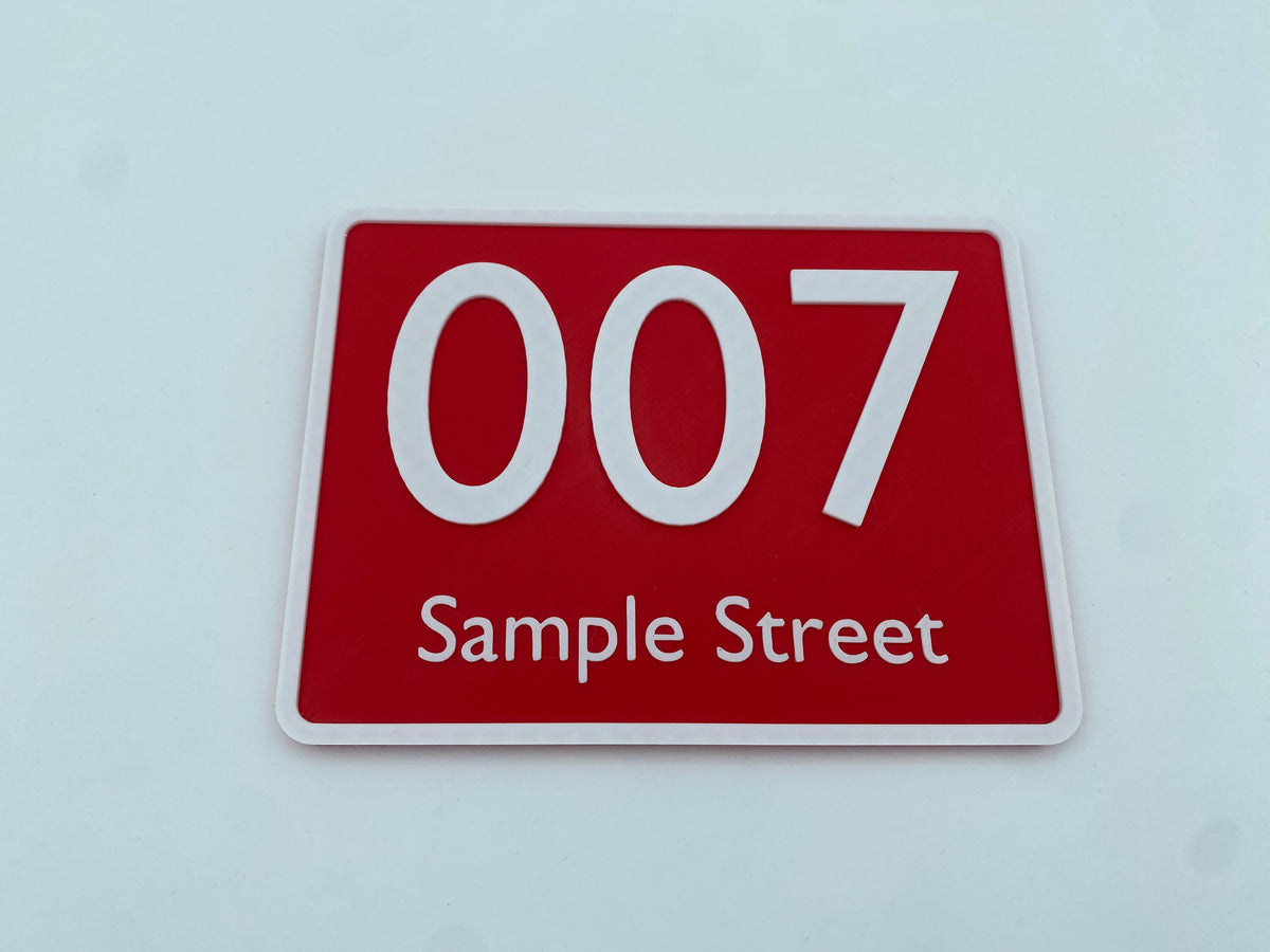 Custom 3D-printed house number sign detail view