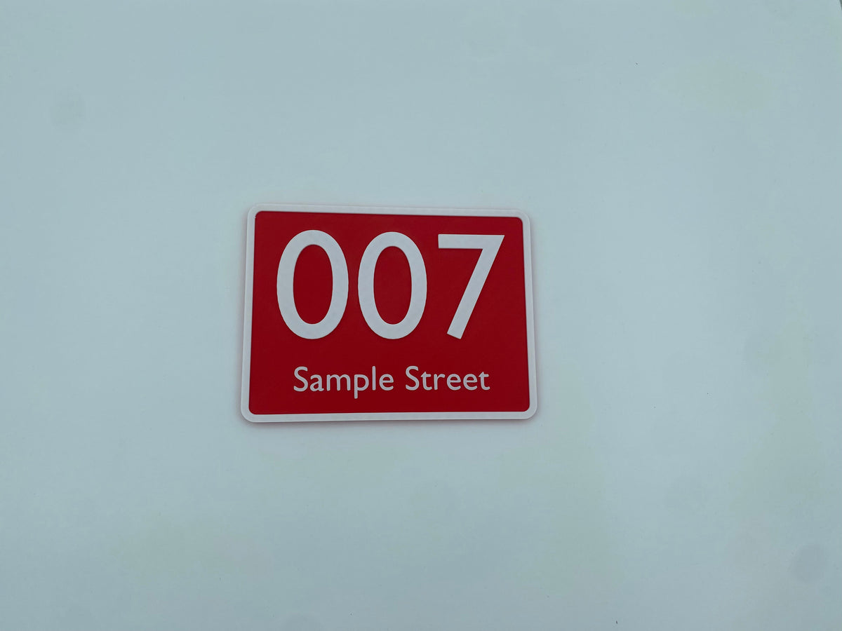 Raised lettering detail on a custom house number sign
