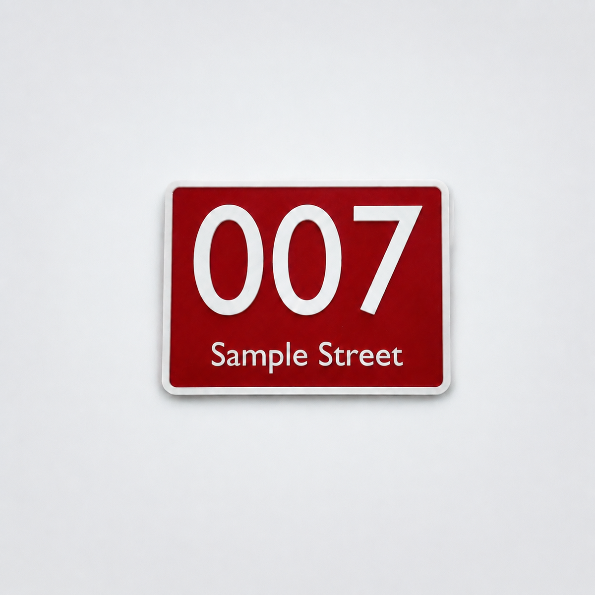Custom red and white 3D-printed house number sign