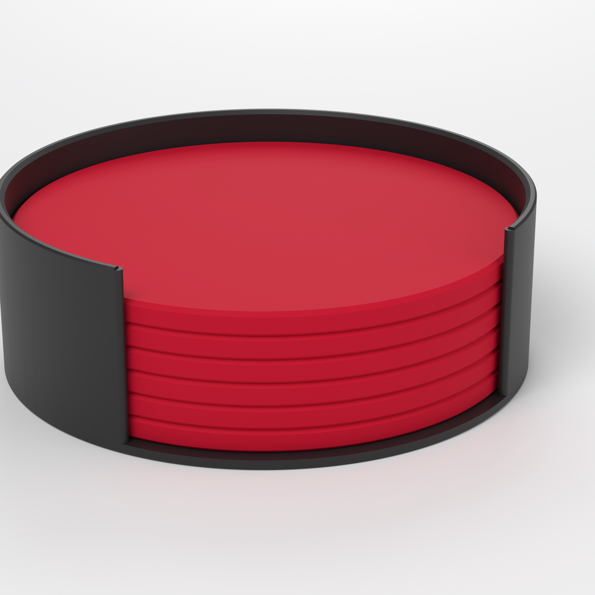 Close-up of red 3D-printed drink coasters stacked in the black stand
