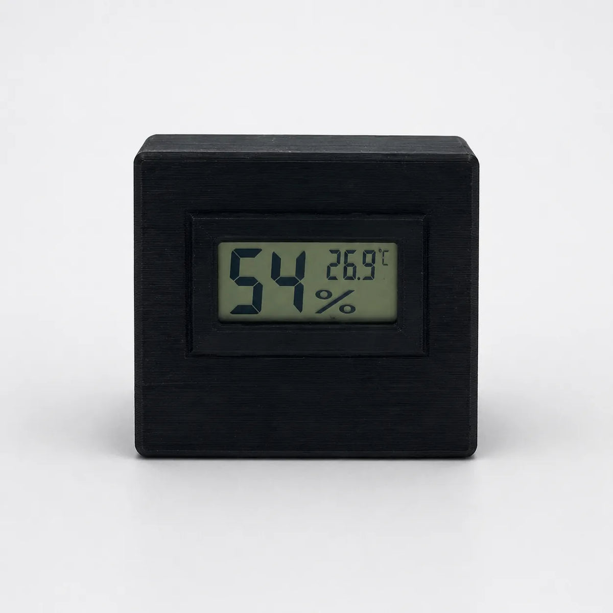 Black digital temperature and humidity sensor, front view