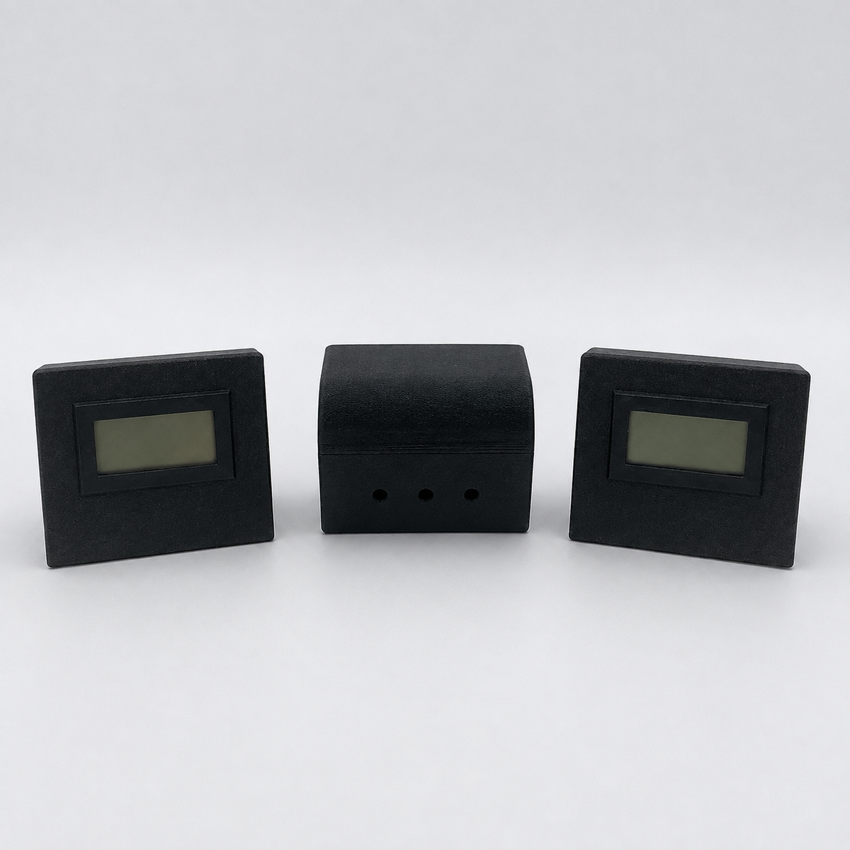 Black temperature and humidity sensor showing front and ventilated rear views