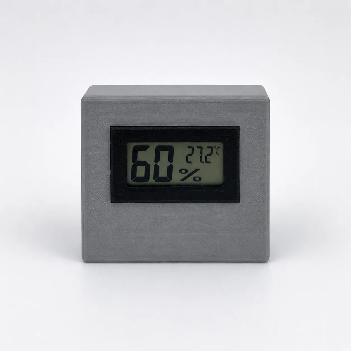 Grey digital temperature and humidity sensor, front view
