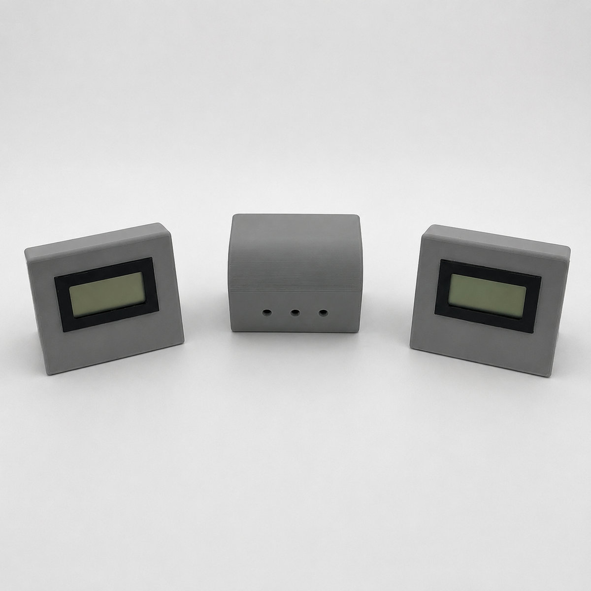 Grey temperature and humidity sensor showing front and ventilated rear views