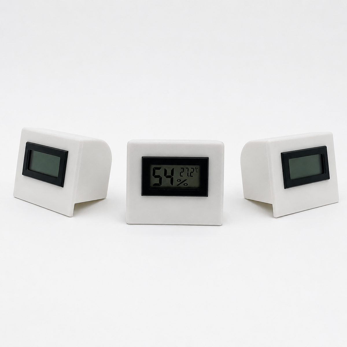 White temperature and humidity sensor shown from three front angles